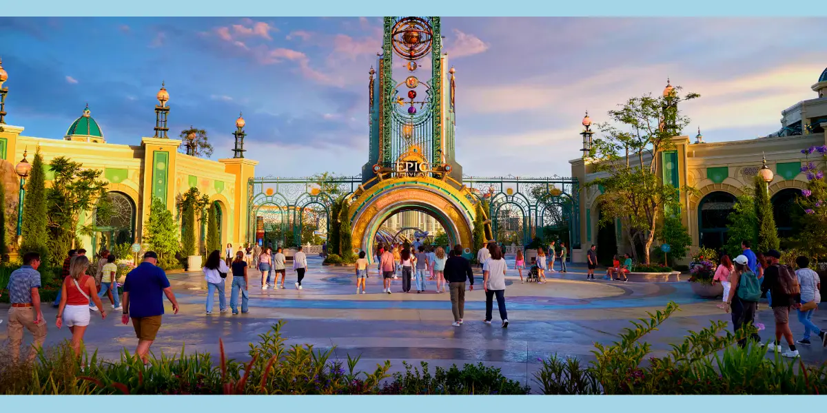 Visitors make their way toward the Celestial Park portal at the main entrance of Universal Epic Universe.